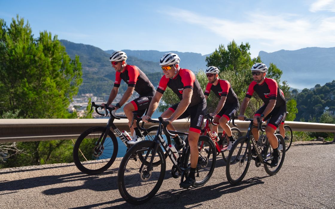 Two riders on a coast road in Mallorca