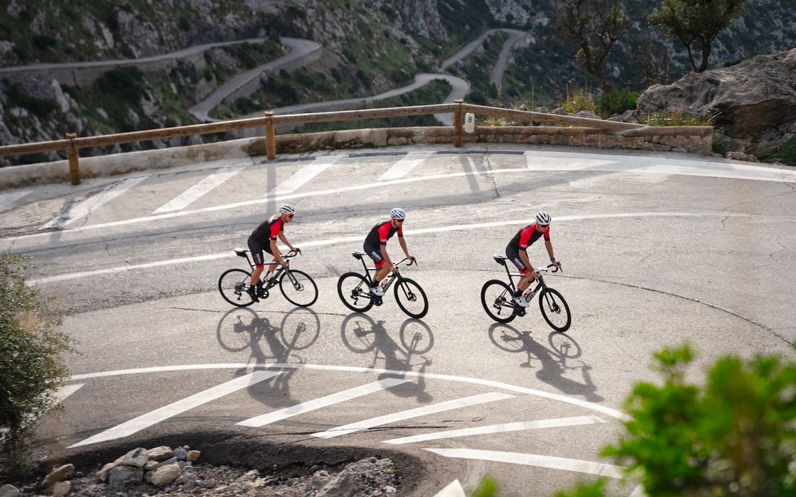 Two riders on a coast road in Mallorca