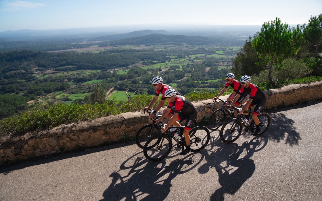 Two riders on a coast road in Mallorca