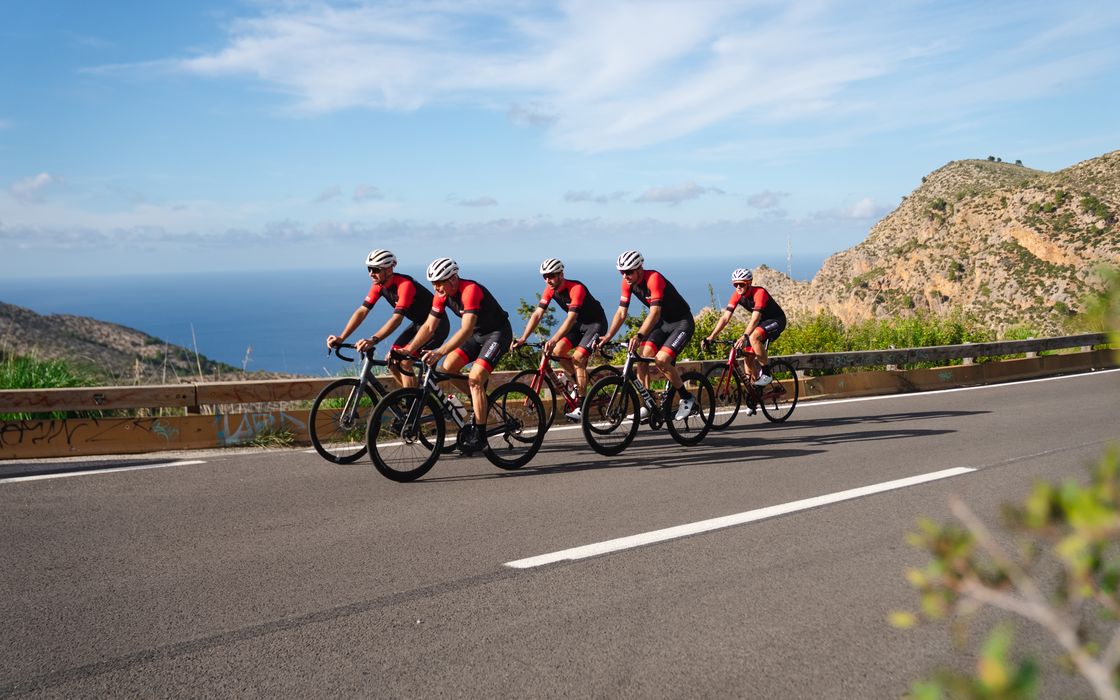 Two riders on a coast road in Mallorca