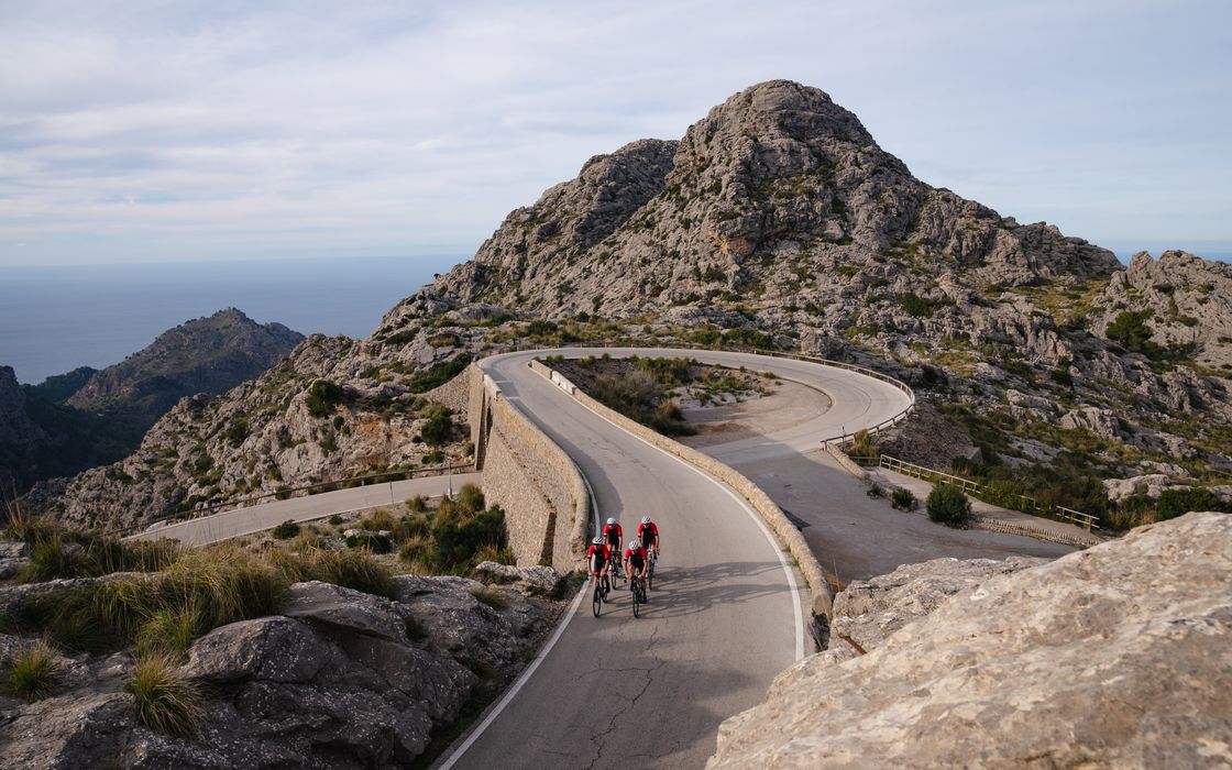 Two riders on a coast road in Mallorca