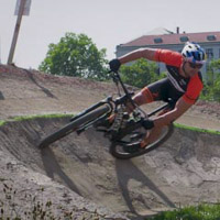 Riding through a corner on a mountain bike